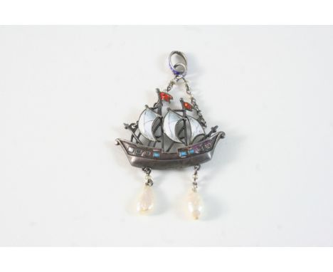AN AUSTRO-HUNGARIAN ENAMEL PENDANT depicting a ship in full sail, 5cm. high.