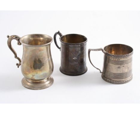 THREE MUGS: A George III example with incised reeded bands & wave-like borders, maker's mark partially worn, London 1815;  a 