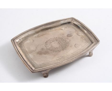A GEORGE III ENGRAVED TEA POT STAND of shaped oblong outline, on bracket feet, by Henry Chawner, London 1792;  6.25"  (15.6 c