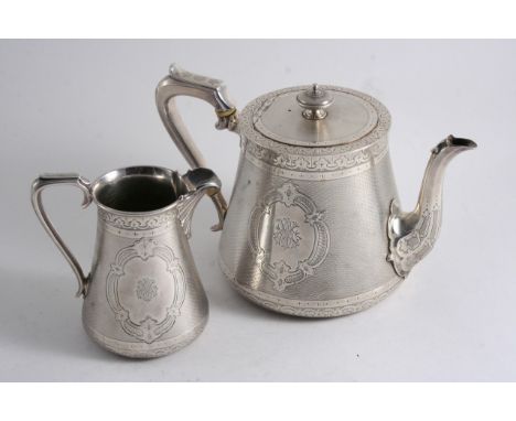 A VICTORIAN TEA POT & MATCHING MILK JUG with tapering bodies, decorated with engraving & engine-turning, monogrammed by Edwar