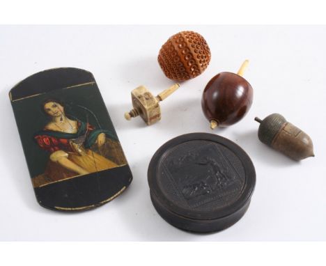 A CIRCULAR PRESSED HORN SNUFF BOX with shooting scene on the cover, early 19th century, a lacquered spectacle's case, a bone 