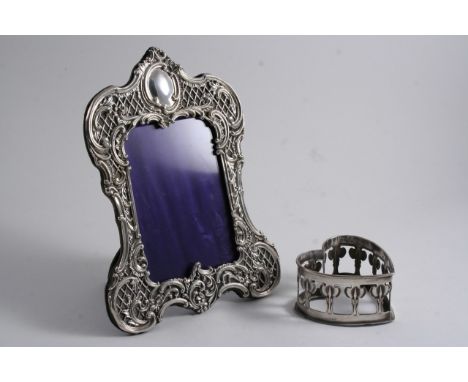 A LATE VICTORIAN MOUNTED PHOTOGRAPH FRAME with an easel stand, by H. Matthews, Birmingham 1893 and an Edwardian heart-shaped,