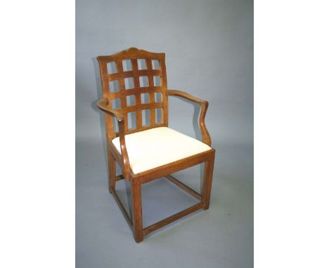 HEALS & SON 'CHARTWELL' ARMCHAIR the oak armchair with a lattice back and drop in seat, unmarked. 39ins (99cms) high *This mo