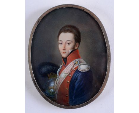 FRENCH SCHOOL 19TH CENTURY A miniature portrait of a young officer in uniform and holding a plumed helmet on ivory, indistinc