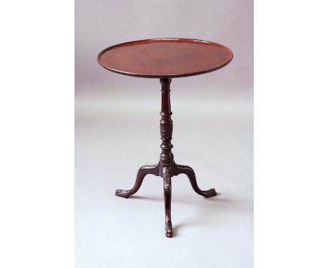 A GEORGE III MAHOGANY TRIPOD TABLE now with a dished circular top, on a stiff leaf carved base, 22ins. (56cms.) dia.