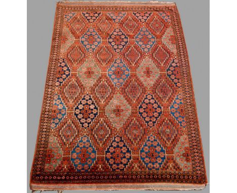 A TURCOMAN SMALL CARPET the brown field woven with a stepped tile pattern, generally good, 9ft 7ins. (246cms.) x 6ft 4ins. (1