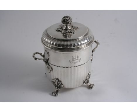 AN EDWARDIAN CIRCULAR BISCUIT BOX & COVER with a bud finial & four leaf & scroll feet, the body with twin handles & a fluted 
