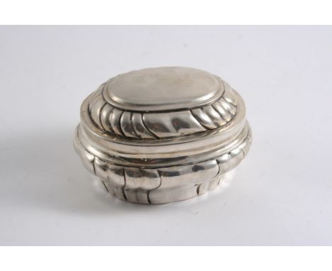 A LATE 18TH CENTURY GERMAN OVAL CADDY with a pull-off cover, decorated with wrythen fluting, maker's mark "NG" or "MG" town m