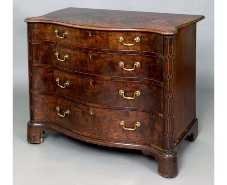 A GEORGE III MAHOGANY SERPENTINE COMMODE probably by Chippendale, the well figured top with a moulded edge, fitted with four 