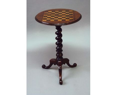 A VICTORIAN ROSEWOOD TRIPOD TABLE the matched top inlaid for chequers, 19ins. (48cms.) wide