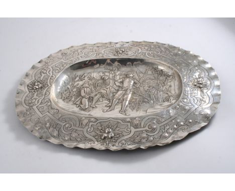 A LATE 19TH CENTURY GERMAN EMBOSSED OVAL BASIN with a crimped border, the centre with an ice skating scene depicting figures 