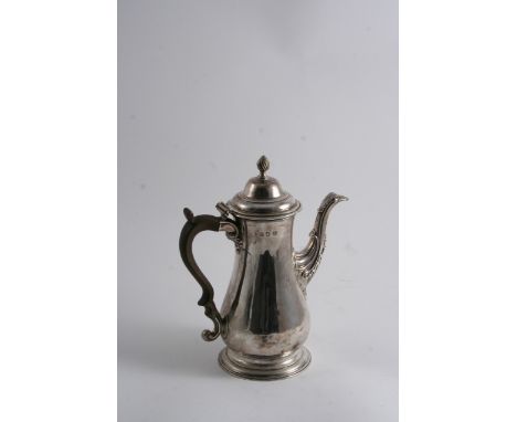 A GEORGE III PLAIN BALUSTER COFFEE POT on a spreading foot, with a domed cover & a wrythen knop finial, by Francis Crump, Lon