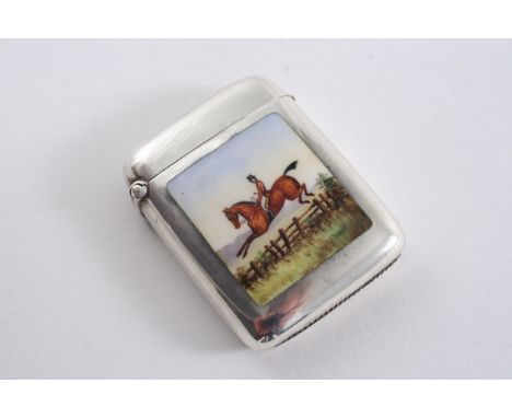 A LATE VICTORIAN VESTA CASE enamelled in polychrome on the front with a fox hunting man on horseback jumping a wooden fence, 