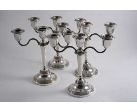A PAIR OF MODERN THREE-LIGHT, DWARF CANDELABRA on round bases with reeded, S-scroll branches by Adie Bros., Birmingham 1960 (