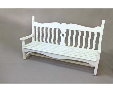 A PAINTED GARDEN BENCH with shaped rails, 72ins. (183cms.) long