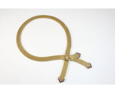 A GOLD, RUBY AND DIAMOND NECKLACE the necklace formed with three rows of hexagonal links, the clasp set with circular-cut dia