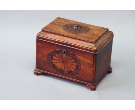 A GEORGE III MAHOGANY TEA CADDY with a coved top, the front inlaid with a shell medallion, the sides and top with a compass s