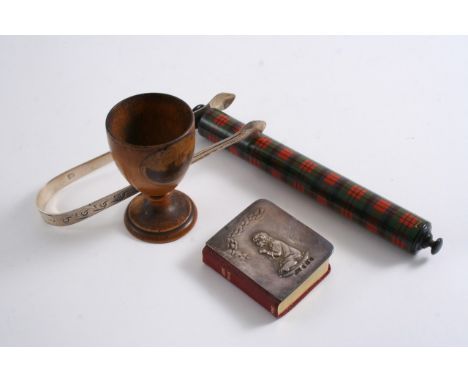 A MIXED LOT: A Tartanware 6" roller rule, (McDuff);  a Mauchlinware egg cup (Hydropathic Establishment, Peebles);  a pair of 