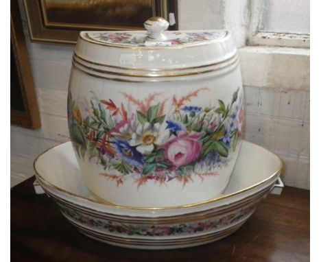 A CONTINENTAL CERAMIC WALL-HUNG WATER CISTERN of barrel-form, decorated with flowers with matching basin