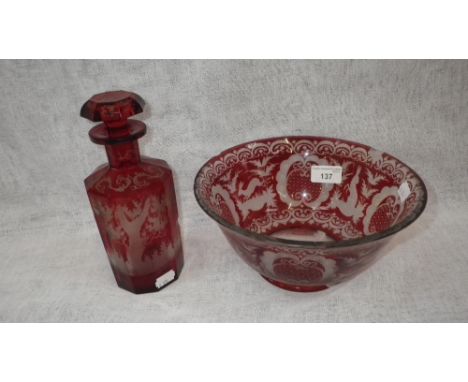 A BOHEMIAN RED OVERLAID AND ETCHED GLASS DECANTER, decorated with deer and a similar bowl