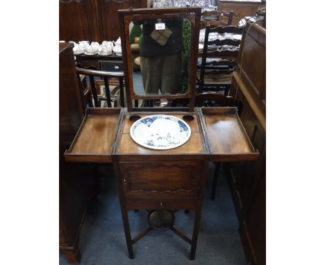 A GEORGE III MAHOGANY WASH STAND with rising mirror back and cupboard below, containing a possibly original First Period Worc
