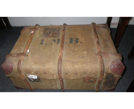 A WOODEN BOUND CANVAS CABIN TRUNK