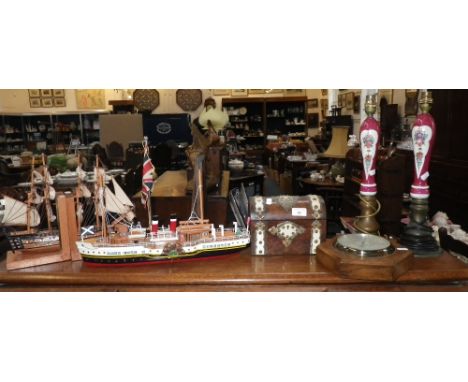 A VICTORIAN BURR WALNUT TEA CADDY with gilt mounts, two beer pumps fitted as lamps, a desk flag, ships model and other items