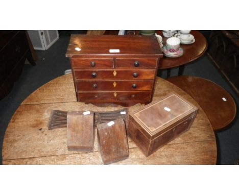 A 19TH CENTURY MINIATURE MAHOGANY CHEST of three long and two short drawers, 14.5" wide, together with a tea caddy and other 