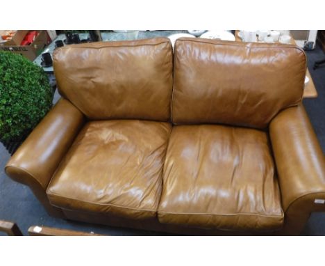 A CONTEMPORARY TWO SEATER LEATHER SOFA, 64" wide