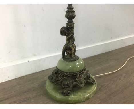 FRENCH STYLE FLOOR LAMP,decorated with a cherub and a large acorn, complete on a marble style base, 140cm high