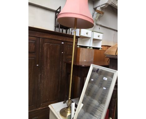 A brass effect standard lamp 