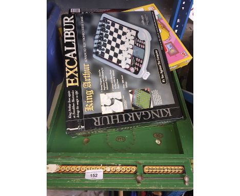 A bagatelle board with marbles and 3 boxed games. 