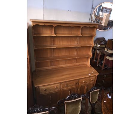 An Ercol light elm dresser, height 192cm, width 146cm. 