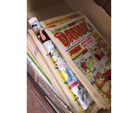 A box of vintage comics, mainly Dandy and Beano. 