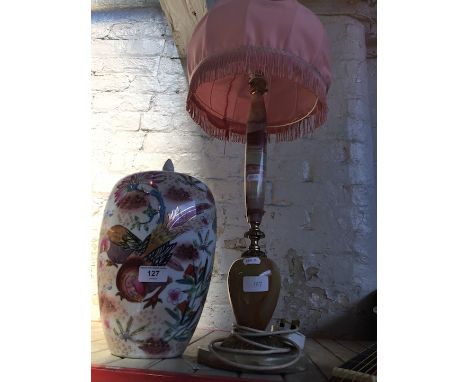 A table lamp and an eastern vase with a lid 