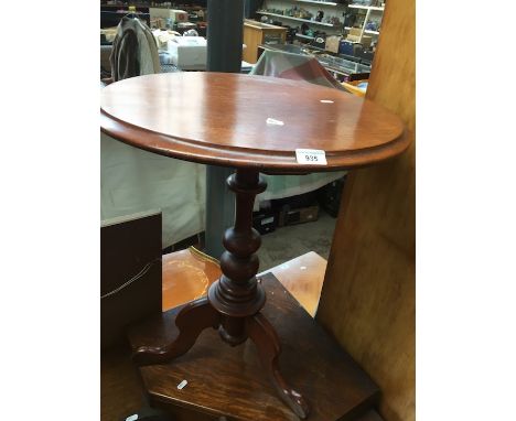 A mahogany tripod table 