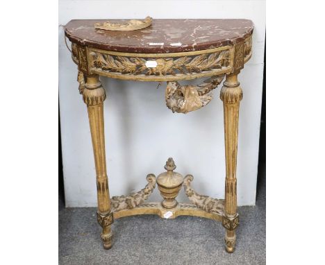 A Marble Topped Console Table, the demi-lune top raised on heavily carved legs with twin reeded and tapered legs, 83cm high b