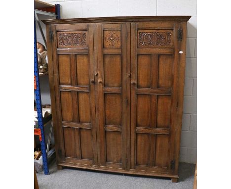 A 17th Century Style Oak Three Panelled-Door Wardrobe, with decorative carved panels, 177cm by 151cm by 49cm, together with a