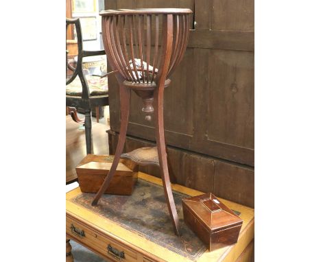 An Edwardian Mahogany Jardiniere, with slatted semi ovoid basket, lacks liner; a 19th Century Rosewood Sarcophagus Tea Caddy,
