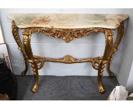 Onyx Topped Gilt Console Table, of serpentine form, 112cm by 33cm by 76cm