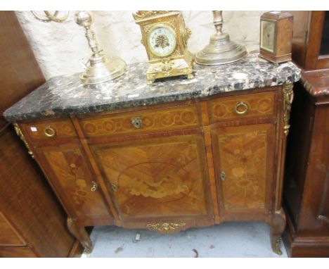 Early 20th Century French kingwood floral marquetry inlaid ormolu mounted breakfront commode, the black flecked marble top ab