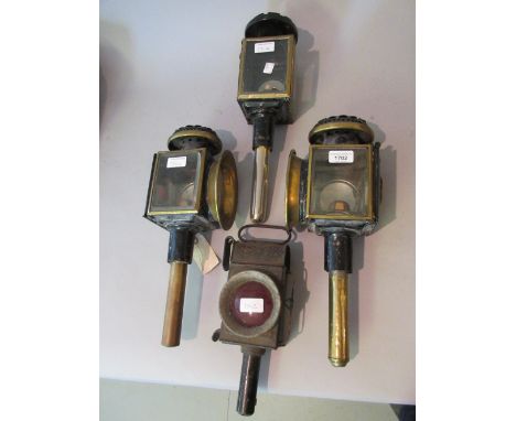 Pair of 19th Century black japanned coach lamps with red lenses, another similar lamp and a single 19th Century brass and bla