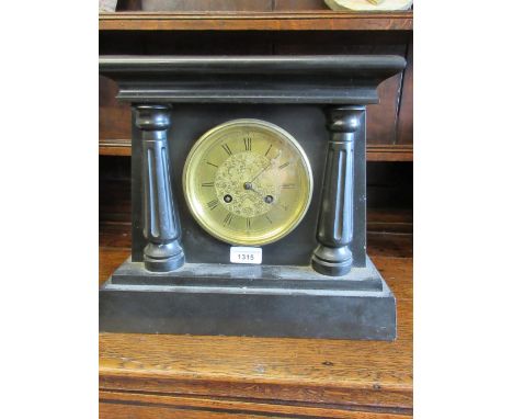 19th Century black slate mantel clock, the architectural case with flanking pilasters, the gilt brass dial with Roman numeral