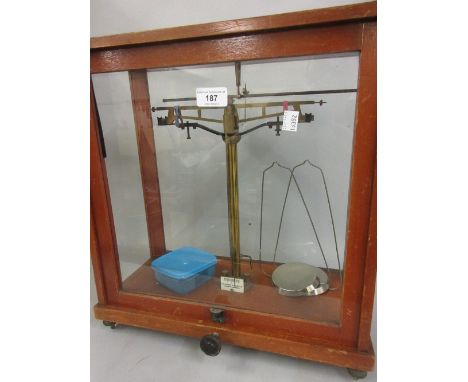 Pair of 20th Century mahogany cased and glazed balance scales by W. and J. George and Becker Ltd, London and Birmingham, 17in