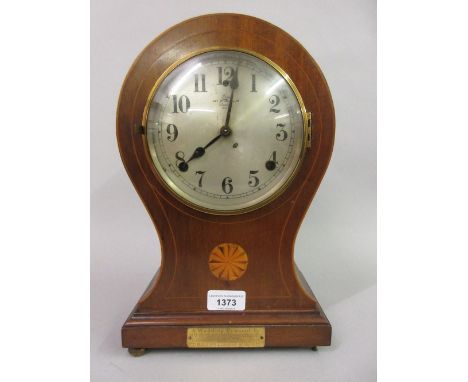 Edwardian mahogany and inlaid balloon shaped mantel clock with a two train movement 