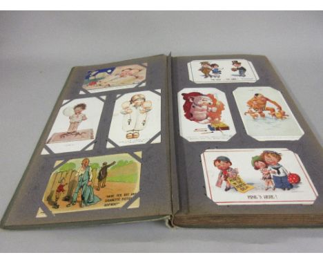 One large green/grey post card album containing approximately two hundred cards, including ' Mabel Lucy Attwell ', ' Louis Wa