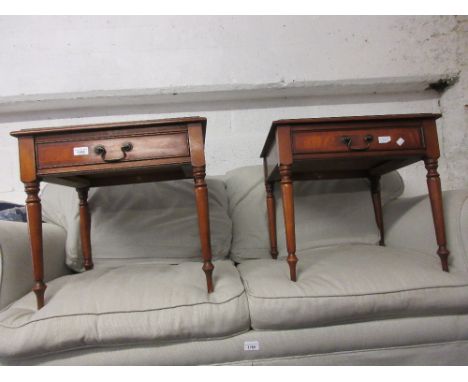 Pair of reproduction mahogany lamp tables each with a single drawer on turned supports 