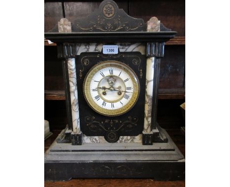 Large 19th Century French black slate and beige marble mantel clock, the enamel dial with Roman numerals, the two train movem