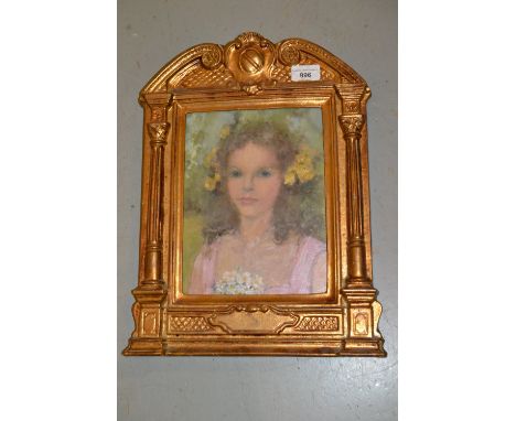 Oil on board, head and shoulder portrait of a child with flowers in her hair, inscribed verso ' Lola Petley ', housed in an a