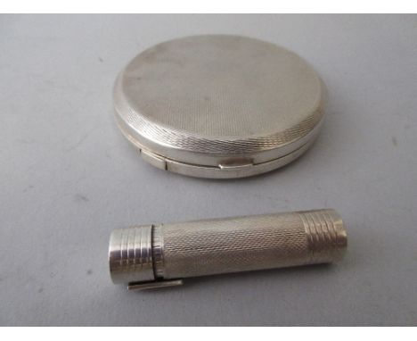 Circular silver compact together with a silver lipstick holder 